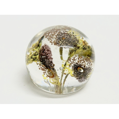 173 - A late 19th/early 20th century glass dump paperweight and 3 others. A vintage millefiori paperweight... 