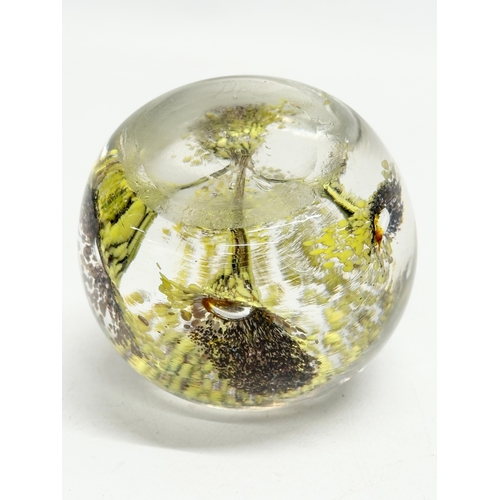 173 - A late 19th/early 20th century glass dump paperweight and 3 others. A vintage millefiori paperweight... 