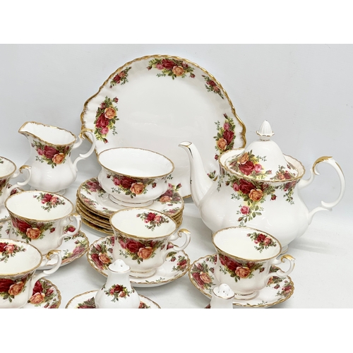 306 - A 26 piece Royal Albert ‘Old Country Roses’ tea service. Teapot 25x15x20cm. 6 cups and 6 saucers. Sa... 