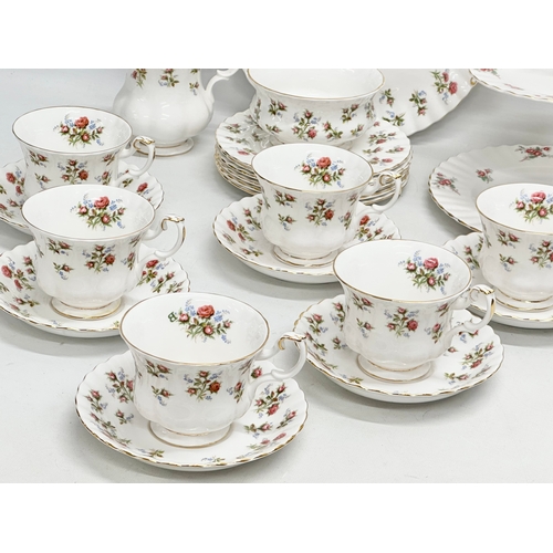 307 - A 22 piece Royal Albert ‘Winsome’ tea service. 2 tier cake stand. Cake plate. 6 cups and 6 saucers. ... 