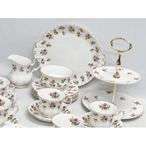 307 - A 22 piece Royal Albert ‘Winsome’ tea service. 2 tier cake stand. Cake plate. 6 cups and 6 saucers. ... 