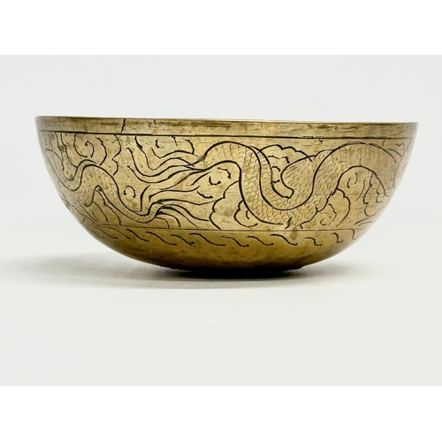 309 - An early 20th century Chinese brass bowl. 16x6.5cm