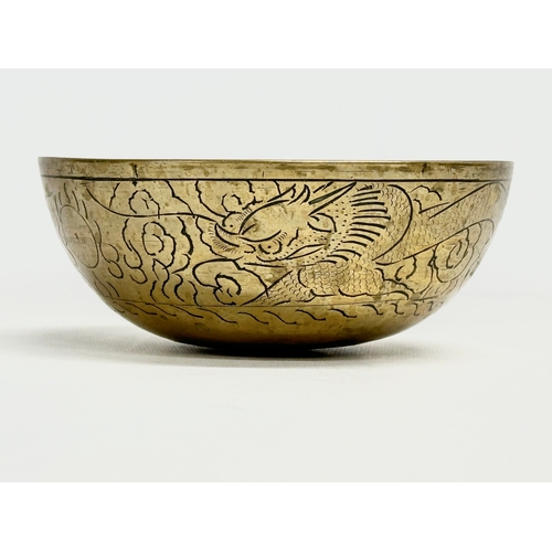 309 - An early 20th century Chinese brass bowl. 16x6.5cm