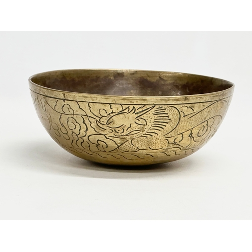 309 - An early 20th century Chinese brass bowl. 16x6.5cm