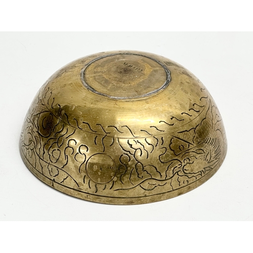 309 - An early 20th century Chinese brass bowl. 16x6.5cm