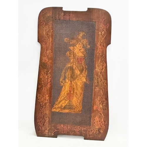 310 - An early 20th century Pokerwork wall plaque. 40x70.5cm