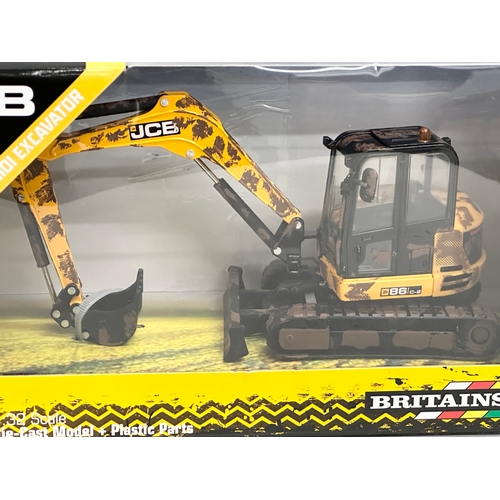 652 - A new Britains Muddy JCB Midi Excavator. 25x11x14cm