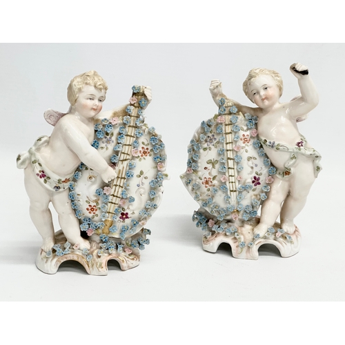 278 - Late 19th century porcelain cherubs. A pair of late 19th century cherub spill vases and a porcelain ... 