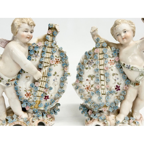 278 - Late 19th century porcelain cherubs. A pair of late 19th century cherub spill vases and a porcelain ... 