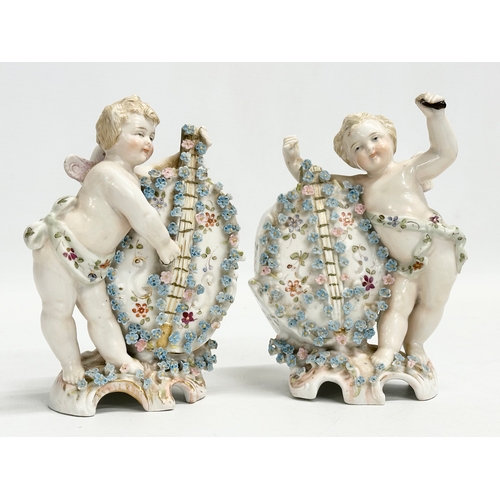 278 - Late 19th century porcelain cherubs. A pair of late 19th century cherub spill vases and a porcelain ... 