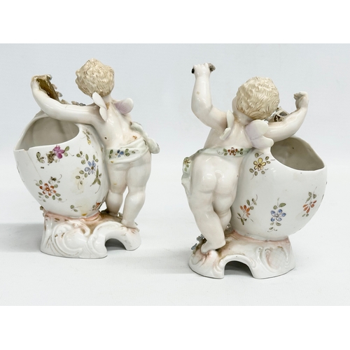 278 - Late 19th century porcelain cherubs. A pair of late 19th century cherub spill vases and a porcelain ... 