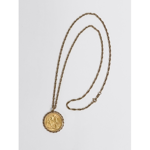 446 - A full gold sovereign with pendant and chain. 1911. 15.55 grams with chain.