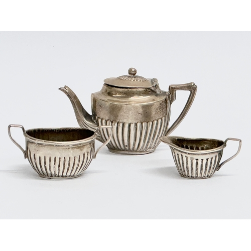 454 - A late 19th century miniature silver tea service. Circa 1898. 18.62 grams. Cornelius Desormeaux Saun... 