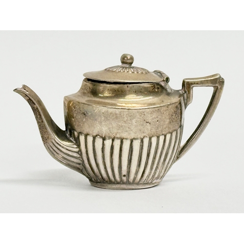 454 - A late 19th century miniature silver tea service. Circa 1898. 18.62 grams. Cornelius Desormeaux Saun... 