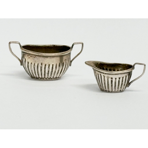 454 - A late 19th century miniature silver tea service. Circa 1898. 18.62 grams. Cornelius Desormeaux Saun... 