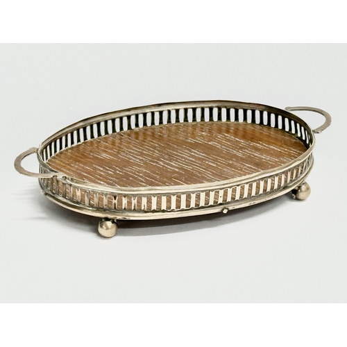 455 - A silver mounted miniature tray. 10x6cm