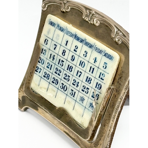 456 - A early 20th century Mappin & Webb silver desktop calendar. Circa 1922-1937. 12x10cm