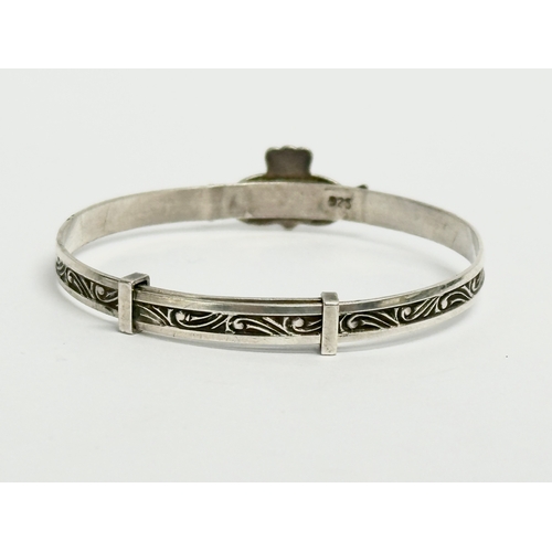 457 - 3 silver children’s bangles. Claddagh bangle measures 4.5x4cm. 14.64 grams total.