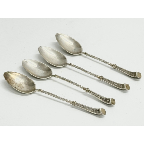 459 - A set of 4 silver spoons stamped 800. 57.15 grams.