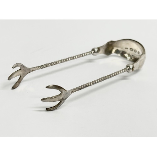 462 - Dutch silver sugar tongs. 13.48 grams. 10cm