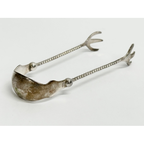 462 - Dutch silver sugar tongs. 13.48 grams. 10cm