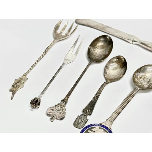 463 - A collection of silver spoons and knife. Sterling Denmark crowned butter knife and pickle fork etc. ... 