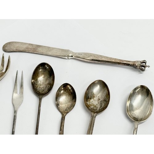 463 - A collection of silver spoons and knife. Sterling Denmark crowned butter knife and pickle fork etc. ... 