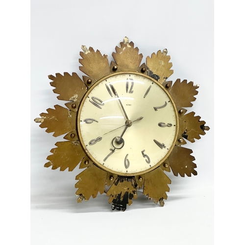 205 - A 1960’s Mid Century sunburst wall clock by Metamec. 32cm