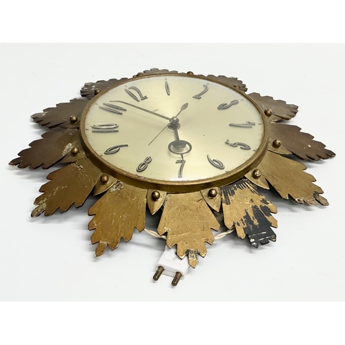 205 - A 1960’s Mid Century sunburst wall clock by Metamec. 32cm