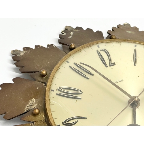 205 - A 1960’s Mid Century sunburst wall clock by Metamec. 32cm