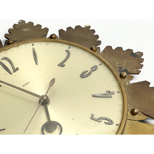 205 - A 1960’s Mid Century sunburst wall clock by Metamec. 32cm