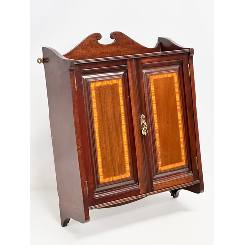 89 - An Edwardian inlaid mahogany wall hanging cabinet. 46x16.5x59.5cm