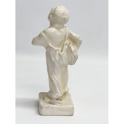 280 - An early 20th century ‘Speshul’ plaster newspaper boy figure. 19cm