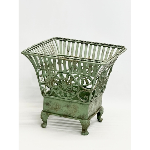 314 - A pair of wrought iron garden planters. Largest 32x32x31cm