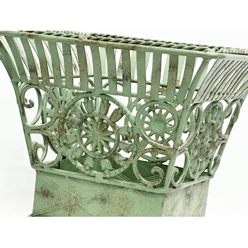 314 - A pair of wrought iron garden planters. Largest 32x32x31cm