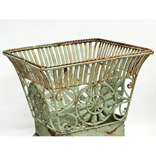 314 - A pair of wrought iron garden planters. Largest 32x32x31cm