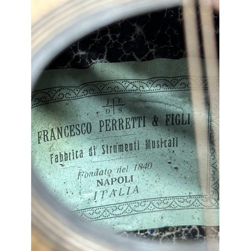 540 - A late 19th/early 20th century Francesco Perretti & Figli mandolin with case.