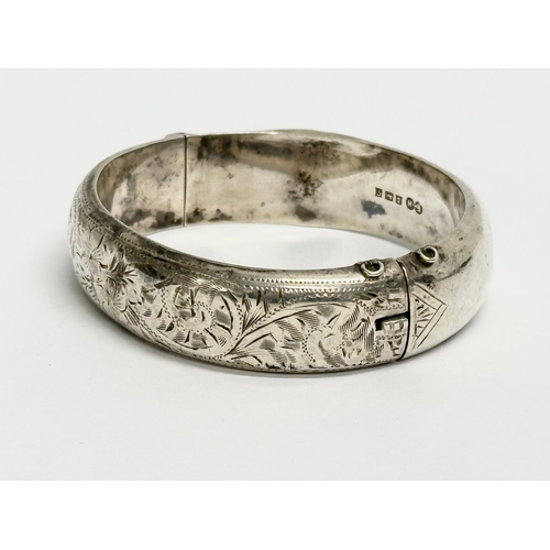 474 - A late 19th century Edwin Horton silver bangle. 7x6cm closed. 25.31 grams.