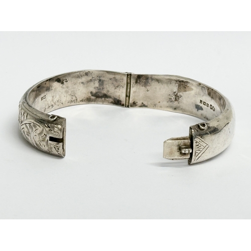 474 - A late 19th century Edwin Horton silver bangle. 7x6cm closed. 25.31 grams.