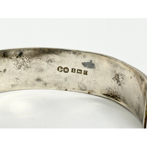 474 - A late 19th century Edwin Horton silver bangle. 7x6cm closed. 25.31 grams.