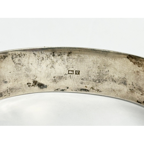 474 - A late 19th century Edwin Horton silver bangle. 7x6cm closed. 25.31 grams.