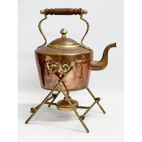 342 - A vintage Victorian style copper and brass spirit kettle. 19x25x32cm