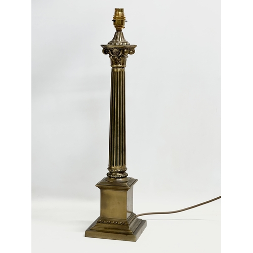 320 - A large brass table lamp with Corinthian style column. 59cm