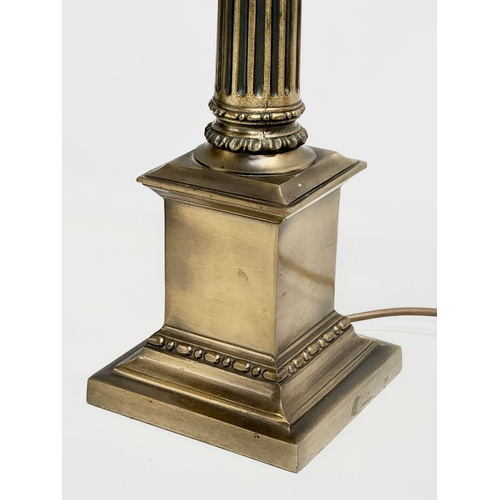 320 - A large brass table lamp with Corinthian style column. 59cm