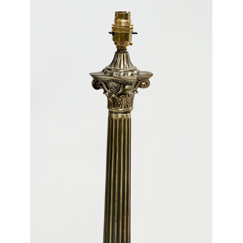 320 - A large brass table lamp with Corinthian style column. 59cm