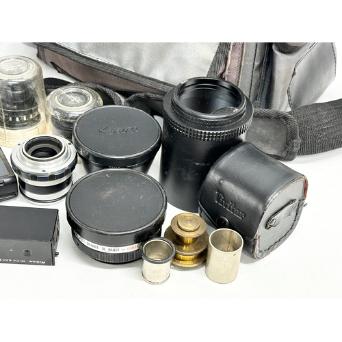 569 - A collection of camera lenses etc.