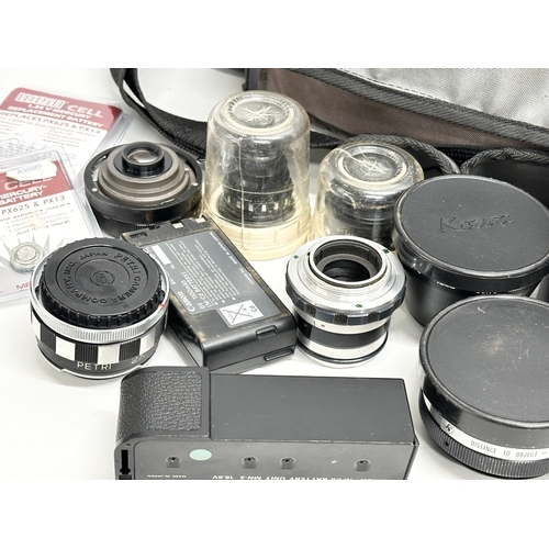 569 - A collection of camera lenses etc.