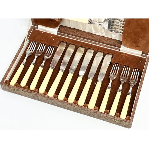 337 - A vintage silver plated cutlery set with bone handles in case. 36.5x22x6cm