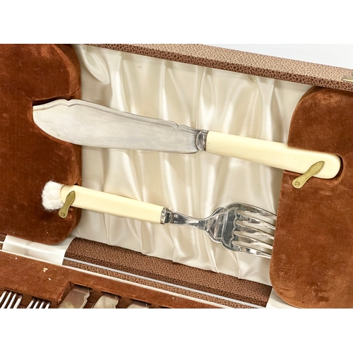 337 - A vintage silver plated cutlery set with bone handles in case. 36.5x22x6cm