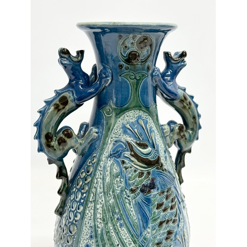 15 - An early 20th century C.H. Brannam Barum Ware glazed pottery vase designed by Frederick Bowden. 1905... 